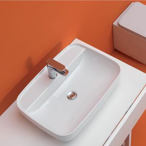 lavabo sobre encimera / ovalado / de cerámica / moderno