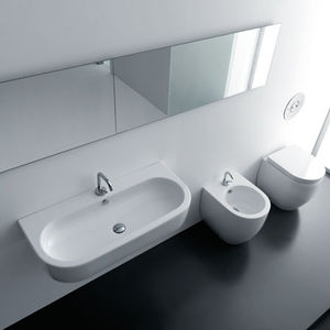 lavabo suspendido / ovalado / de cerámica / moderno