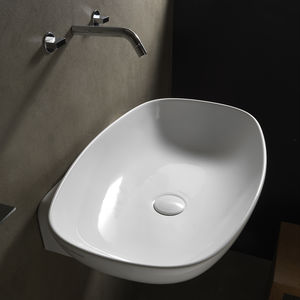 lavabo suspendido / ovalado / de cerámica / moderno