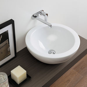 lavabo sobre encimera / redondo / de cerámica / moderno