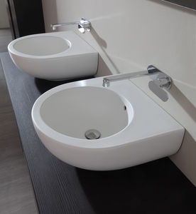 lavabo doble / sobre encimera / redondo / de cerámica