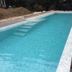 piscina semienterrada / de piedra / para el sector servicios / de exterior
