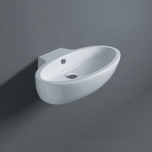 lavabo suspendido / ovalado / de cerámica / moderno