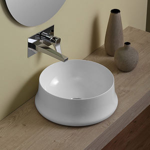 lavabo sobre encimera / redondo / de cerámica / moderno