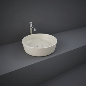 lavabo suspendido / redondo / de cerámica / moderno
