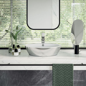 lavabo sobre encimera / ovalado / de cerámica / moderno