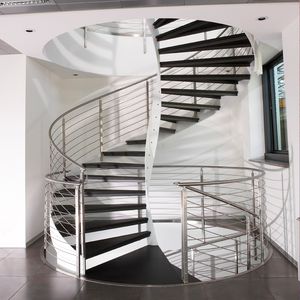 escalera de caracol / estructura de acero inoxidable / con peldaños de piedra / con contrahuellas