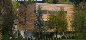 casa prefabricada / minimalista / con armazón de madera / de alerce