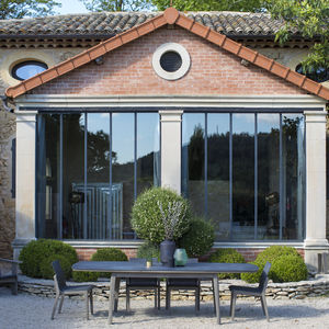 mesa de comedor de diseño escandinavo / de teca / de HPL / ovalada