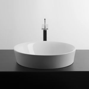 lavabo sobre encimera / rectangular / de porcelana / moderno