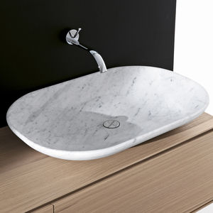 lavabo sobre encimera / de piedra natural / moderno / con estantería integrada