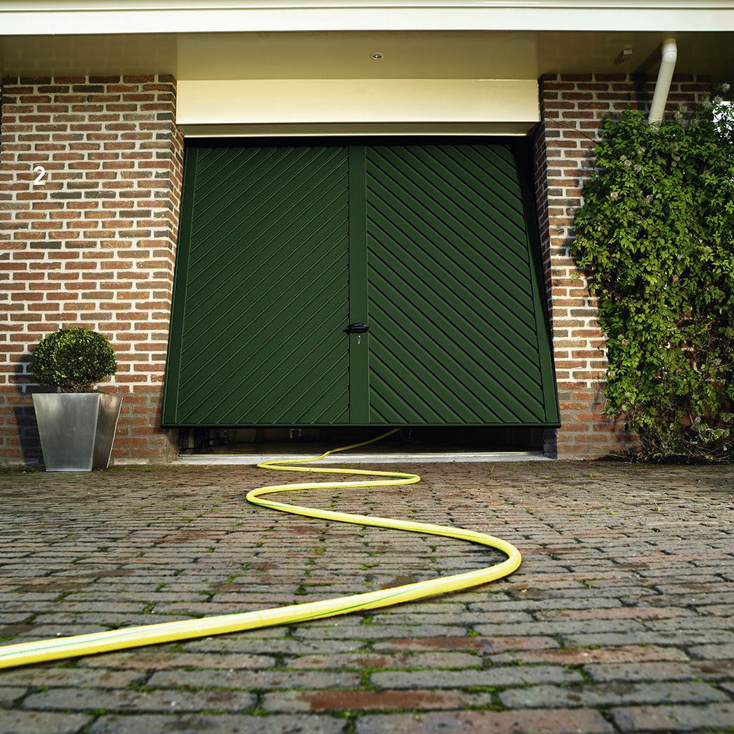 Puerta de garaje basculante - Novoferm - de acero galvanizado / automática