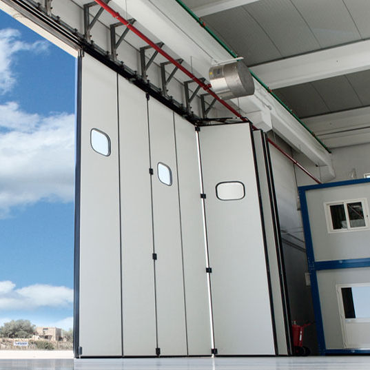 Puerta industrial para hangar KOPRON plegable / de metal / automática