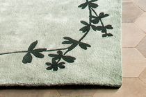 Alfombra contemporánea / con motivos decorativos...