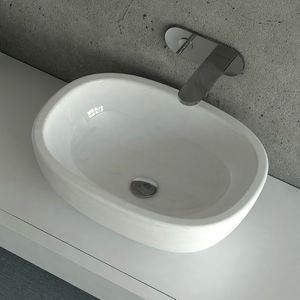 lavabo sobre encimera / ovalado / de cerámica / moderno