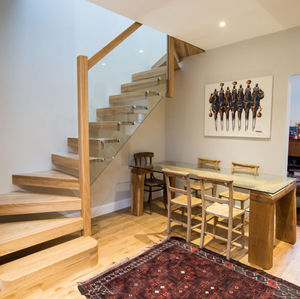 escalera en L / estructura de madera / con peldaños de madera / sin contrahuellas