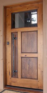 puerta de entrada / pivotante / de madera / de acero