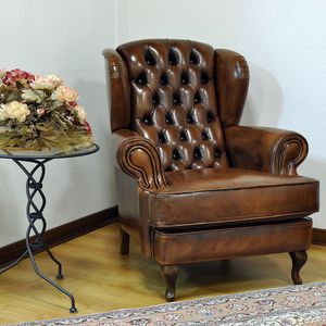 sillón Chesterfield / de tejido / de cuero / con orejas