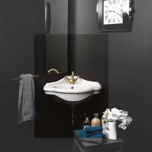lavabo suspendido / de esquina / de cerámica / moderno