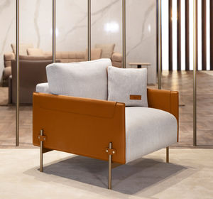 sillón moderno / de cuero / de tejido / de metal lacado
