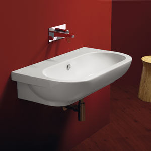 lavabo suspendido / ovalado / de cerámica / contemporáneo
