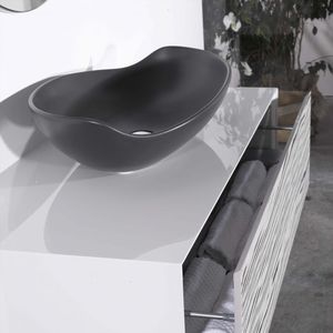 lavabo sobre encimera / ovalado / de cerámica / contemporáneo
