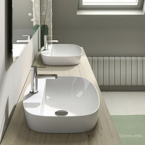 lavabo semiencastrado / ovalado / de cerámica / contemporáneo