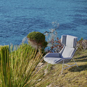 sillón contemporáneo / de tejido / de acero / con reposapiés