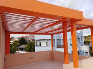 pérgola adosada