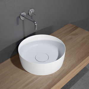 lavabo sobre encimera / redondo / de cerámica / contemporáneo
