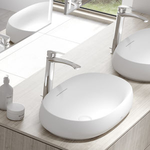 lavabo sobre encimera / ovalado / de cerámica / contemporáneo