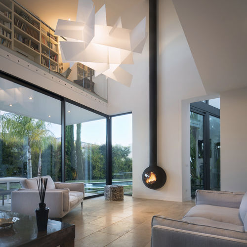 Chimenea de leña - EMIFOCUS HUBLOT - Focus Creation - de pared / adosada / Cara única