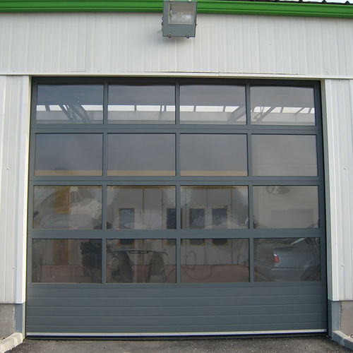Puerta industrial seccional - FULL VISION - SMF Services - de metal / automática / para hangar