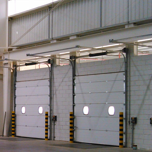Puerta industrial seccional - SEMI-VERTICAL LINTEL - KOPRON - de metal / automática / con aislamiento térmico