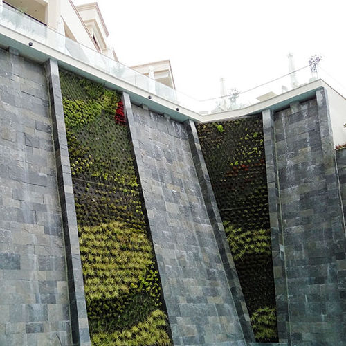 Muro vegetal estabilizado - IKOS OCEANIA CLUB - Paisajismo Urbano - de plantas naturales / de panel modular / biológico