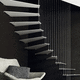 escalera en L / en U / con peldaños de metal / para uso residencial