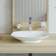lavabo con grifo mezclador / sobre mueble / de cerámica / curvado