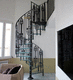 escalera de caracol / con peldaños de vidrio / con estructura de acero / para uso residencial