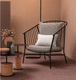 sillón contemporáneo / de cuero / de tejido / de acero