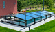 cubierta para piscina baja / telescópica / de policarbonato / con accionamiento manual
