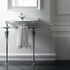 lavabo consola / de porcelana / con encimera / con toallero integrado