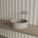 lavabo sobre mueble / de hormigón / redondo / sin orificio