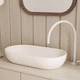 lavabo sobre mueble / de hormigón / acabado mate / ovalado