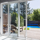 cortina de cristal corredera / de PVC / con vidrio doble / de 2 batientes