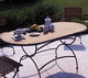 mesa contemporánea / de teca / con base metálica / ovalada