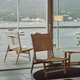 sillón contemporáneo / de cuero / de haya / con respaldo alto