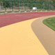 pavimento deportivo de exterior / de caucho / para campo deportivo / duradero