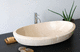 lavabo sobre mueble / de piedra natural / ovalado / contemporáneo