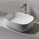lavabo sobre mueble / de cerámica / ovalado / sin orificio