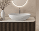 lavabo sobre mueble / de piedra calcárea / ovalado / sin orificio